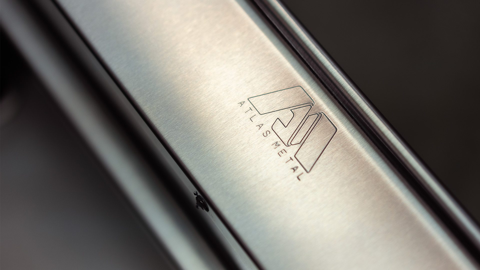 Atlas Metal logo engraved on stainless steel foodservice equipment