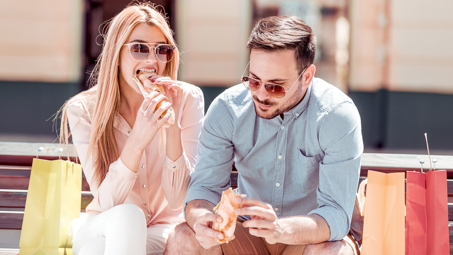 Customers eating outside a convenience store