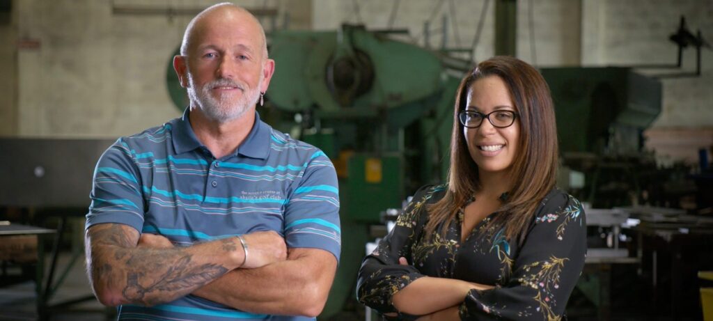 Atlas Metal team members standing in the manufacturing facility