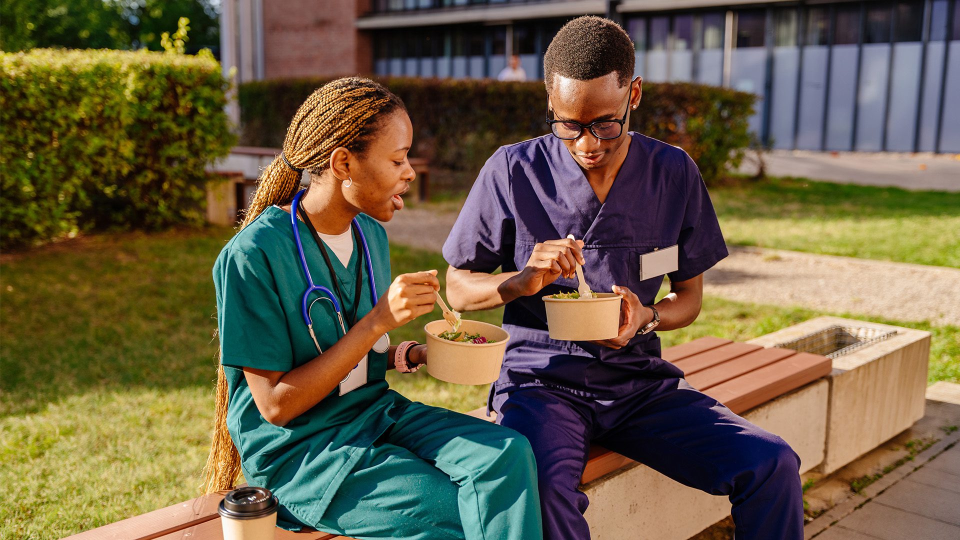 Healthcare workers eating together during a break