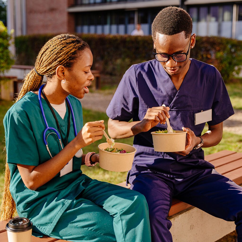 Healthcare workers eating together during a break