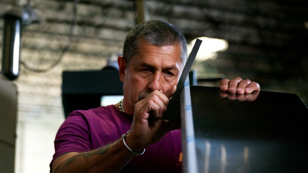 Doninick Sr, Engineering manager at Atlas Metal inspecting handcrafted foodservice equipment